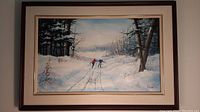 Front view of framed painting showing winter ski scene