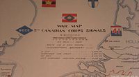 Center of map showing title, insignia, scale and route legend.