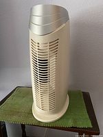 Front view of off-white Hunter Tower Air Purifier with vertical grill, showing overall condition and design.