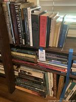Photo showing books on a bookshelf, titles include Agatha Christie, design and historical books