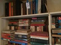 Books on shelves with visible titles about Soviet Russia, Stalin, Genocide, and European history.