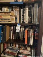 Bookshelf with multiple Gore Vidal books including Burr, Lincoln, Creation, and 1876 alongside other historical and political titles.