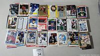 Multiple stacks of assorted sports cards shown from a top-down view with visible hockey cards featuring various players.