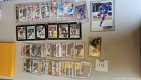 Overhead view of top and middle rows of Gretzky trading cards in penny sleeves and holders
