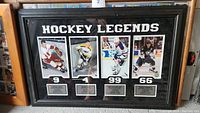 Full view of the framed hockey legends collage with the title 'HOCKEY LEGENDS' and photos of four players with plaques.