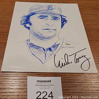 Full view of the limited edition print showing hand-drawn portrait of Mike Torrez in blue ink with his signature and number 11/200 with artist's signature.