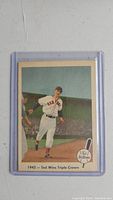 Front of 1959 Ted Williams baseball card with image of Williams running bases and '1942 - Ted Wins Triple Crown' caption.