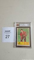 Front of the encapsulated card showing Stan Mikita in Chicago Black Hawks uniform with KSA grading label 6.5 ENM at top.