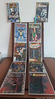 Full view of 10 Batman comics laid out including visible covers with various Batman artwork.