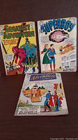 All three comic books displayed showing cover art and general condition.
