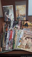 26 assorted DC Vertigo The Books of Magic comic books laid out to show cover art and quantity.