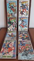 Eight Superboy comic books arranged in two columns, showing full front covers, featuring colorful comic art.