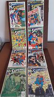 8 DC Superboy comic books displayed in two columns showing full front covers with bright colors and comic art.