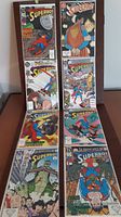 Photo showing arrangement of 8 Superboy comic book covers in two vertical rows.