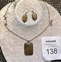 Full jewelry set with bronzite stone pendant necklace and matching earrings with 925 stamped hooks shown with lot number tag.