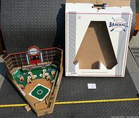 Full view of wooden pinball game with box showing size and condition.