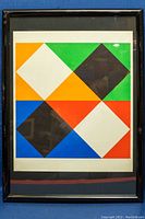 Front view of framed serigraph print featuring geometric shapes in multiple colors.