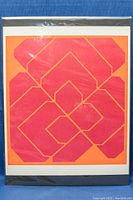 Front view of the serigraph print showing the geometric abstract design in red and orange.