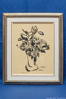 Framed artwork showing a stylized black dry brush oil painting of flowers in a vase, with artist signature visible