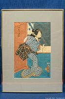 Full view of the framed Japanese woodblock print showing the entire artwork and frame.