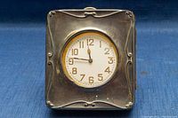 Front view of sterling silver case/stand with pocket watch inserted