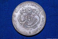 Photo of the front side of the coin showing dragon design with inscriptions 'KIANG SI PROVINCE' and '7 MACE AND 2 CANDAREENS'