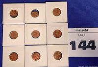 Photo showing 9 Canadian pennies mounted in individual cardboard coin holders arranged in a grid.