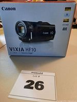 Box of the Canon Vixia HF10 camcorder showing front image and features like Full HD 1080, AVCHD, SDHC compatible.
