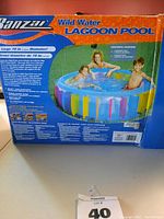 Box for the Banzai Wild Water Lagoon Pool showing vibrant multi-color striped inflatable pool with children playing inside.
