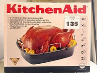 Box of KitchenAid Non Stick Roaster showing product details and image of finished roast chicken inside the pan.