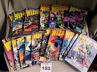 Photo showing all 17 WIZARD magazines arranged in two rows showing colorful comic book covers from 1994 to 1999