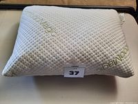 Set of two white Bamboo Magic pillows with textured cover and logo embroidery.