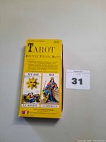 Yellow box with tarot card illustrations Le Soleil and LEMPEREUR II on front, identified as The Circa 14th Century Tarot Fortune Telling Game printed in 1978.
