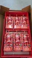 Lot of 12 Coca-Cola Santa playing card tins in original red retail display box.
