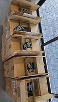 Six factory cardboard cases each holding rows of sealed MLB MVP pin cards