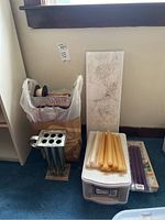 Overview of candles, candle mold, wicks, plastic storage box with candles, and packaging bag.