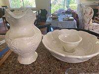 Photo showing ceramic pitcher next to serving and dip bowls on kitchen counter