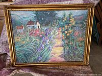 Frontal view of signed painting and ornate gilded frame