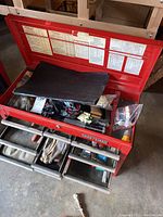 Front perspective with lid open showing interior liner and exterior paint wear