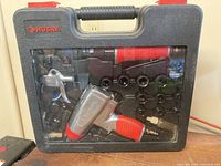 Closed case showing Husky branding and tools inside through clear window.