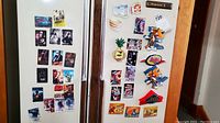 Magnets on right fridge door showing novelty character shaped magnets and chip clip magnets including Cheetos Cheetah.