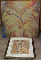 Acrylic on canvas 'Seatedfigure' by Ron Martin, showing warm abstract figure in unframed 30x30 canvas, placed behind framed photo print.