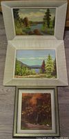 Three framed paintings: two oil paintings on board by William Carson featuring nature scenes with water and trees; one oil on canvas painting titled 'Sugar Maples in Fall' by Heinz Pundleider showing autumn trees.