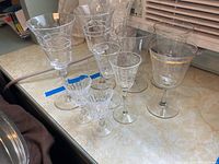 View of all 10 stemware glasses grouped showing varying styles and sizes including liqueur and wine glasses
