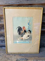 Full view of framed artwork showing original bamboo-style frame with visible broken glass and matting that surrounds watercolour painting of hen, rooster and chicks.