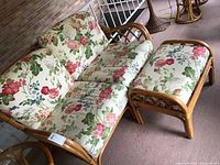 Overview of the Braxton Culler loveseat and ottoman set showing floral upholstery and bamboo frame construction.