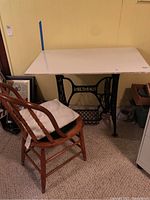 Vintage Singer sewing machine legs with white marble top and wooden chair with cushion