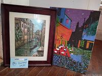 Both oil paintings on canvas shown side by side on floor, one framed and one unframed.