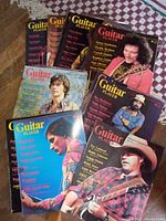 Fifteen Guitar Player magazines arranged showing covers with various guitarists from 1975-1976.