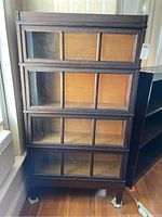 Front view showing four glass-panel doors and missing hardware